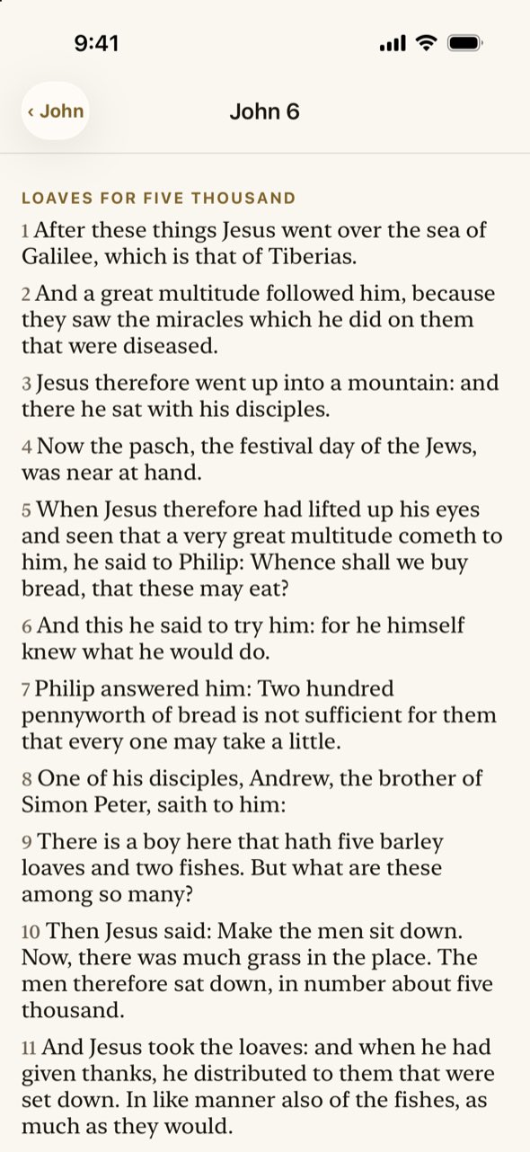 The Bible reader open at John chapter 6 in the Douay-Rheims translation.